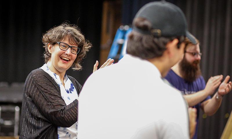 Heidi Winters Vogel interacts with students backstage